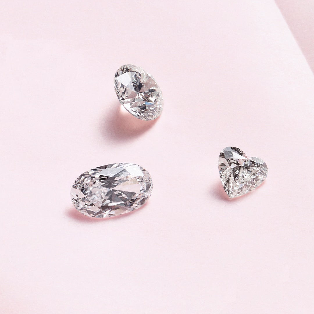 Three diamond on a light pink background