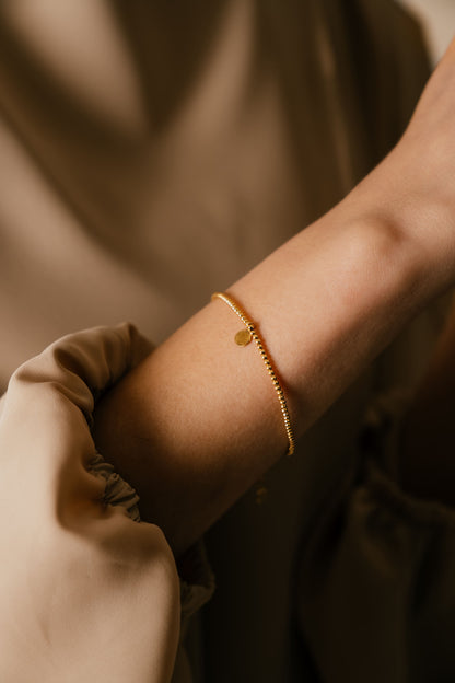 Model wearing Shams 18k gold bracelet by Hafeez Jewellery London