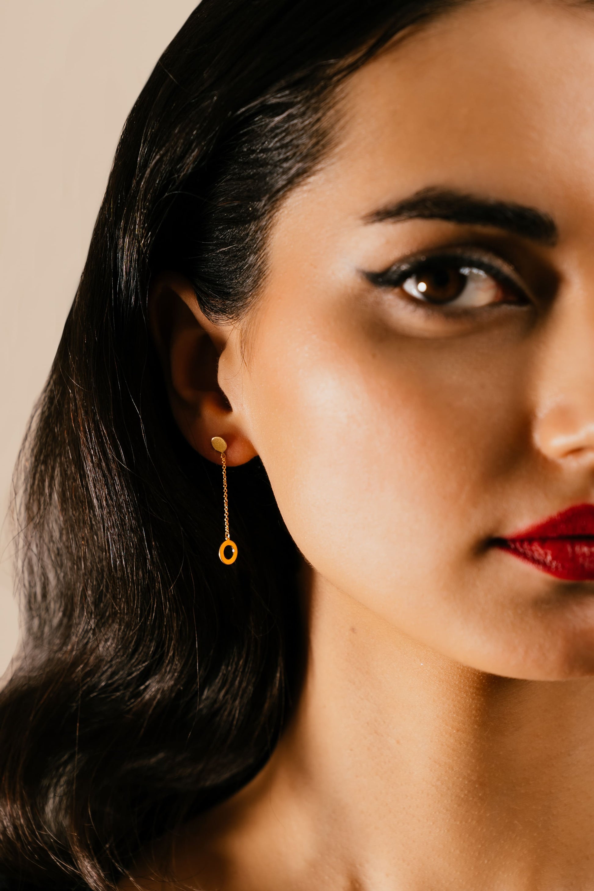 Model wearing Shams 18k gold earrings by Hafeez Jewellery London