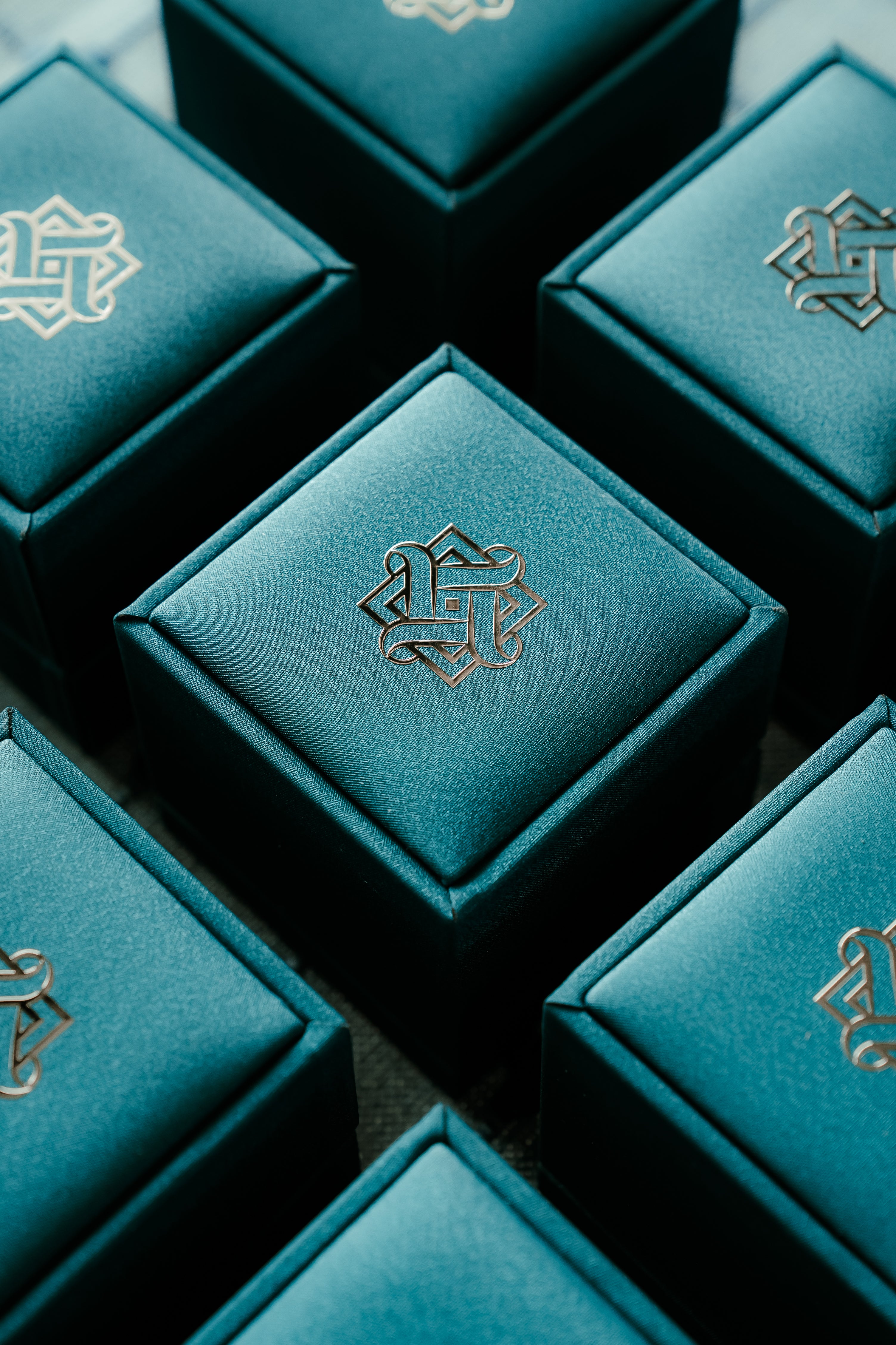 Hafeez teal blue ring boxes with golden logo