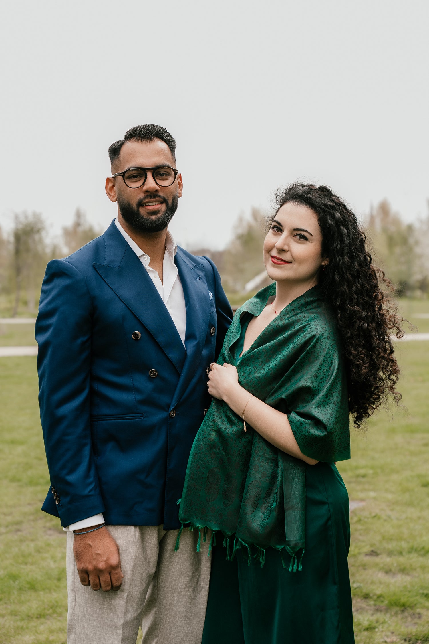 Hafeez Jewellery founders standing together in a grassy outdoor setting