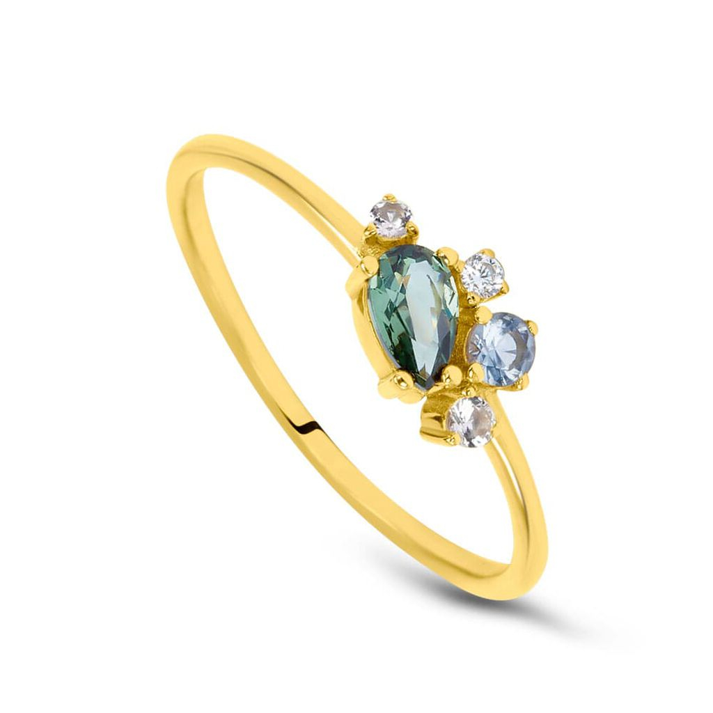 Gold ring with green gemstone and small  round diamonds and topaz on a white background