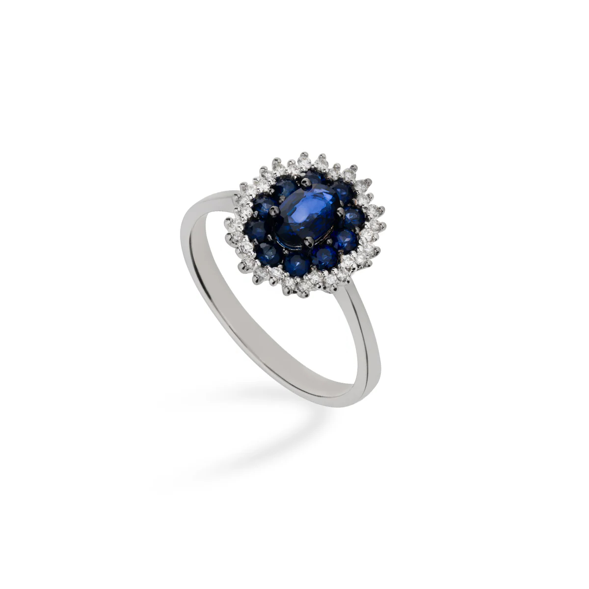 Platinum ring with a blue gemstone  and white diamonds on a white background