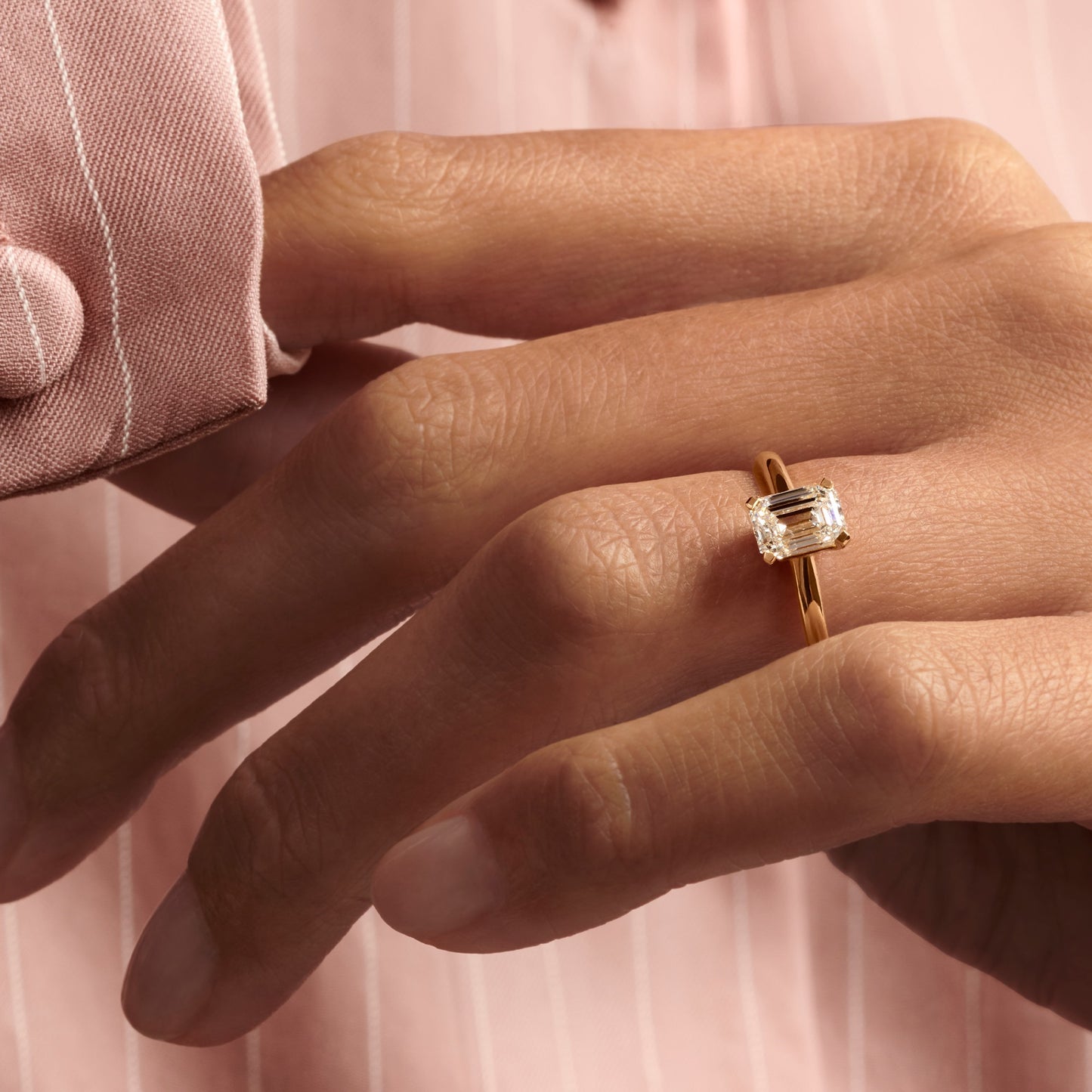 Hafeez Jewellery London Musk 18k yellow gold emerald diamond solitaire engagement ring - on hand model