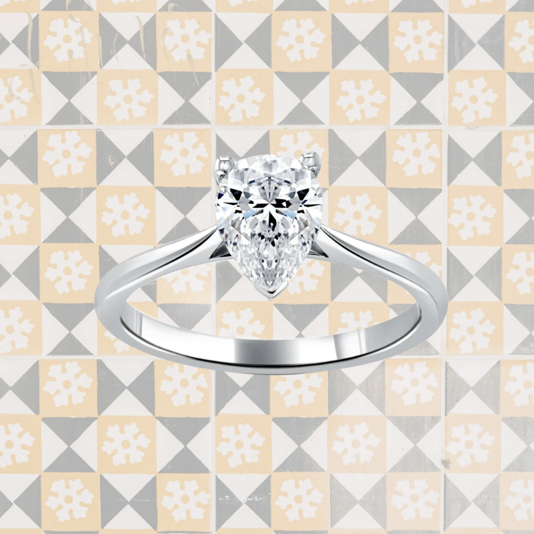 Hafeez Jewellery London Musk 18k white gold pear diamond solitaire engagement ring - pattern