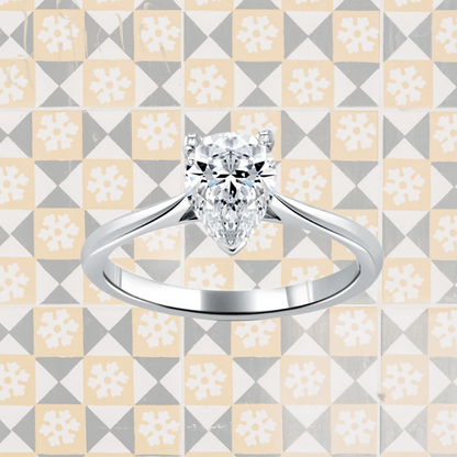 Hafeez Jewellery London Musk 18k white gold pear diamond solitaire engagement ring - pattern