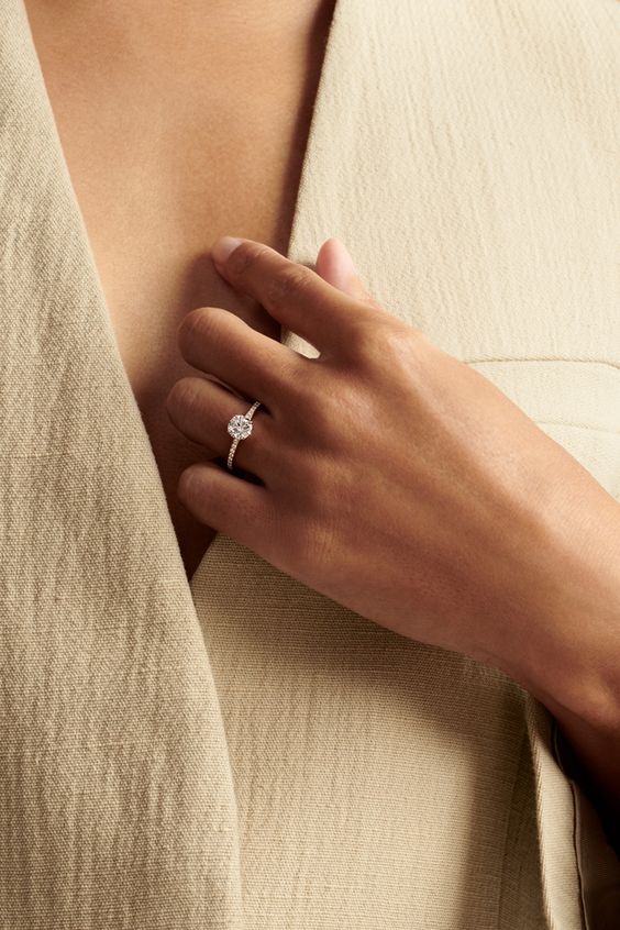 Hafeez Jewellery London Amber 18k whitegold round diamond side stone engagement ring - on hand model